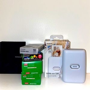 Instax Mini photo printer with assorted films and photo album